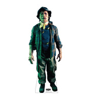Life-size cardboard cutout of a character resembling Beetlejuice from the 2024 film, standing with a greenish hue and wearing a plaid shirt and hat.